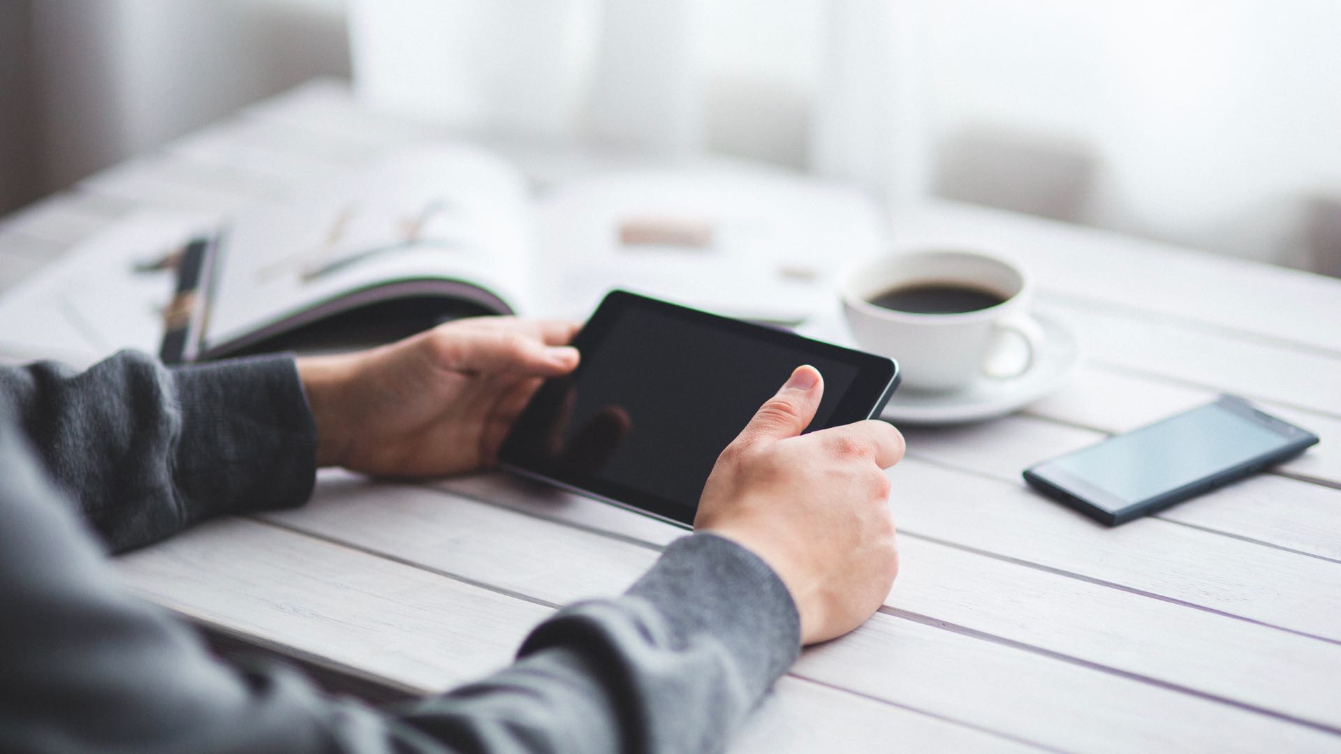 Man Reading Tablet